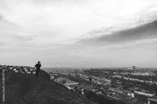 A Man Making a Phone Call on Top of a Hill