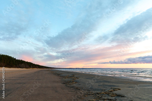 Fototapeta Naklejka Na Ścianę i Meble -  Seashore and waves at sunset. Calmness, awareness, the path to yourself. Harmony and life without stress