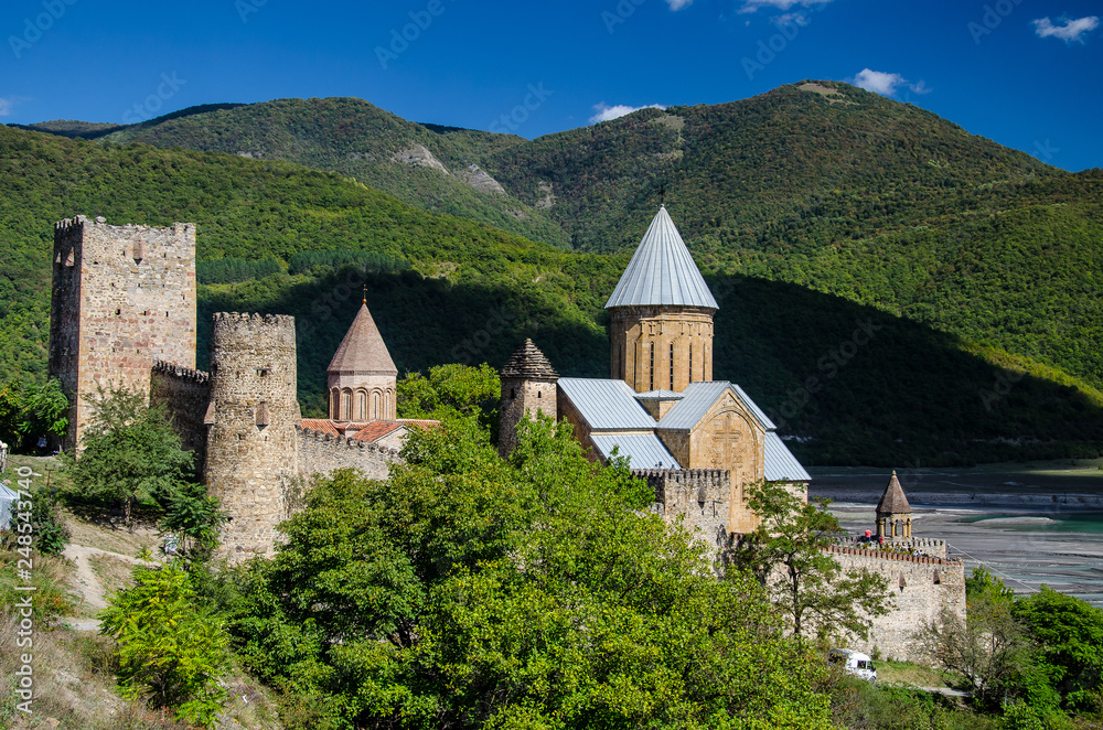 Church of the Mother of God, Ananuri with mountains and blue sky with few clouds above