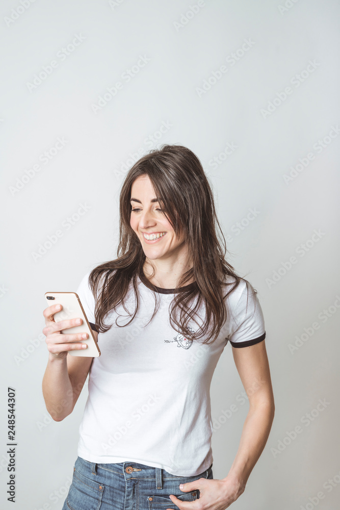 Beautiful woman using mobile in white background Beautiful woman using mobile in white background