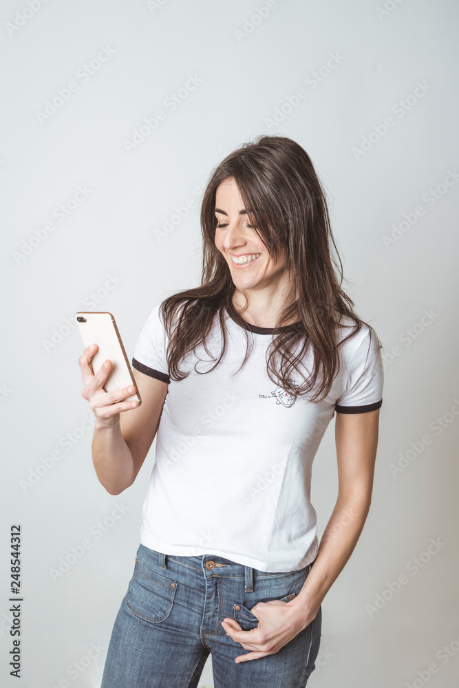 Beautiful woman using mobile in white background Beautiful woman using mobile in white background