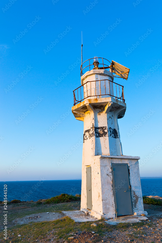 Lighthouse on background of blue clear sky Lighthouse on background of blue clear sky