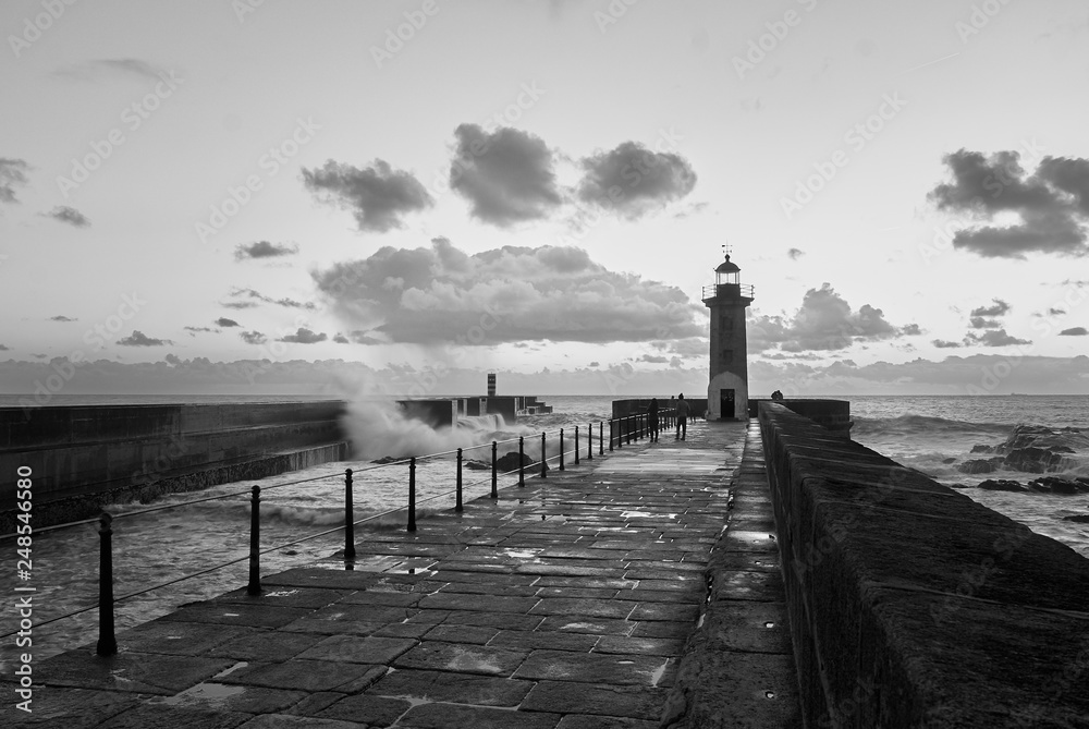 Lighthouse at the Douro mouth in Porto at sunset