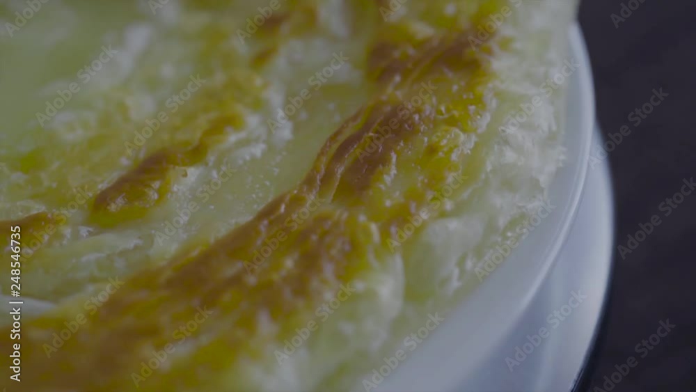 Rotating piece of Parata Bread or Roti Canai soft bread popular breakfast meal among Indian & Malaysian Rotating piece of Parata Bread or Roti Canai soft bread popular breakfast meal among Indian & Malaysian