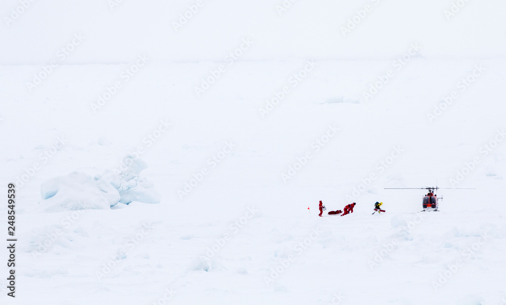 Scientists over an ice floe for research are evacuated by helicopter Scientists over an ice floe for research are evacuated by helicopter