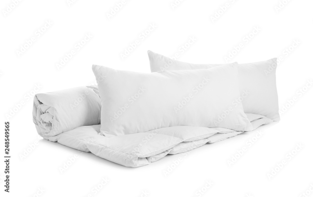 Soft blanket and pillows on white background Soft blanket and pillows on white background