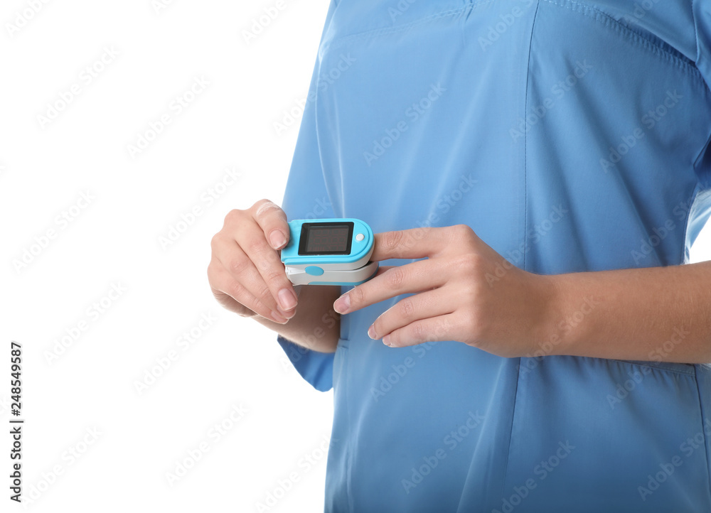 Female doctor using heart rate monitor on white background, closeup. Medical object