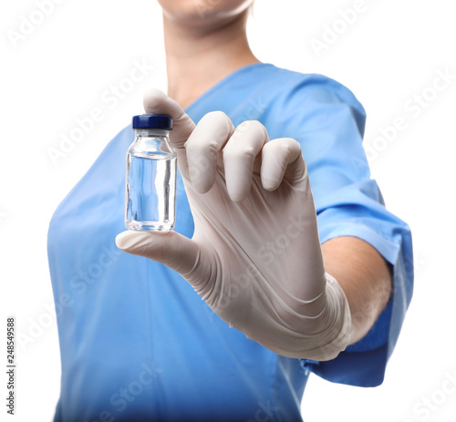 Tableau sur toile Female doctor holding ampule with vaccine on white background, closeup