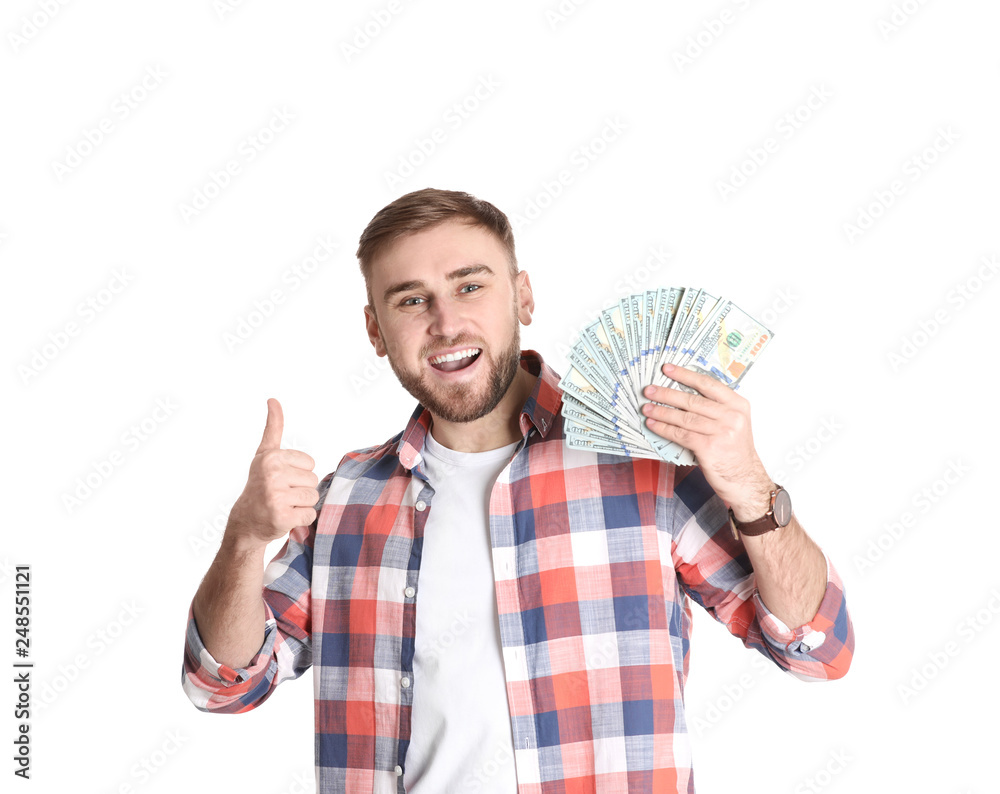 Portrait of young man holding money banknotes on white background Portrait of young man holding money banknotes on white background