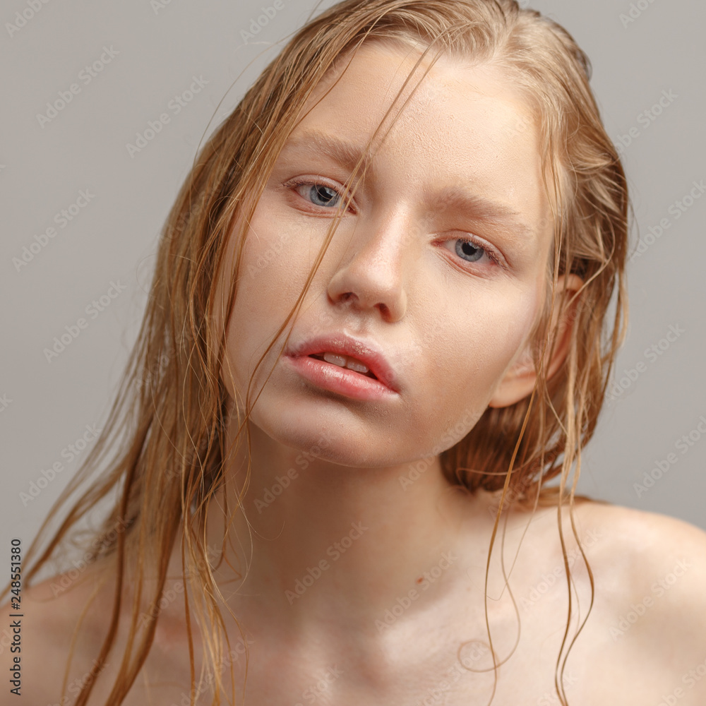 Young beautiful girl with nude makeup and wet hair. Young beautiful girl with nude makeup and wet hair.