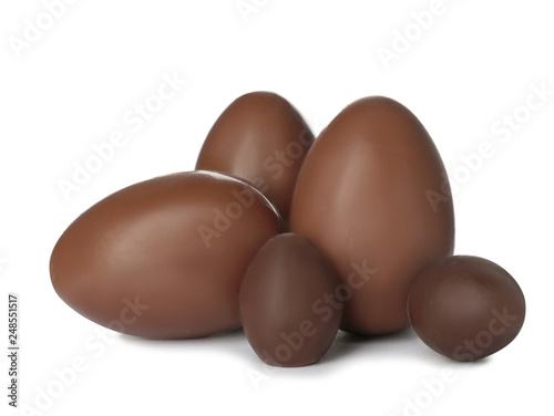 Tasty chocolate Easter eggs on white background