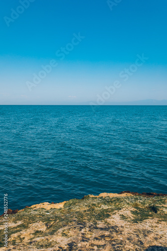 Sea or ocean and rocks at the summer season sunny day. Beautiful scenic nature landscape.