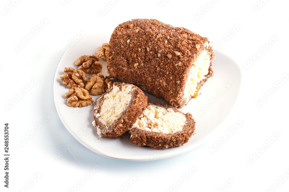 Roll cake with curd and walnuts isolated on white background...