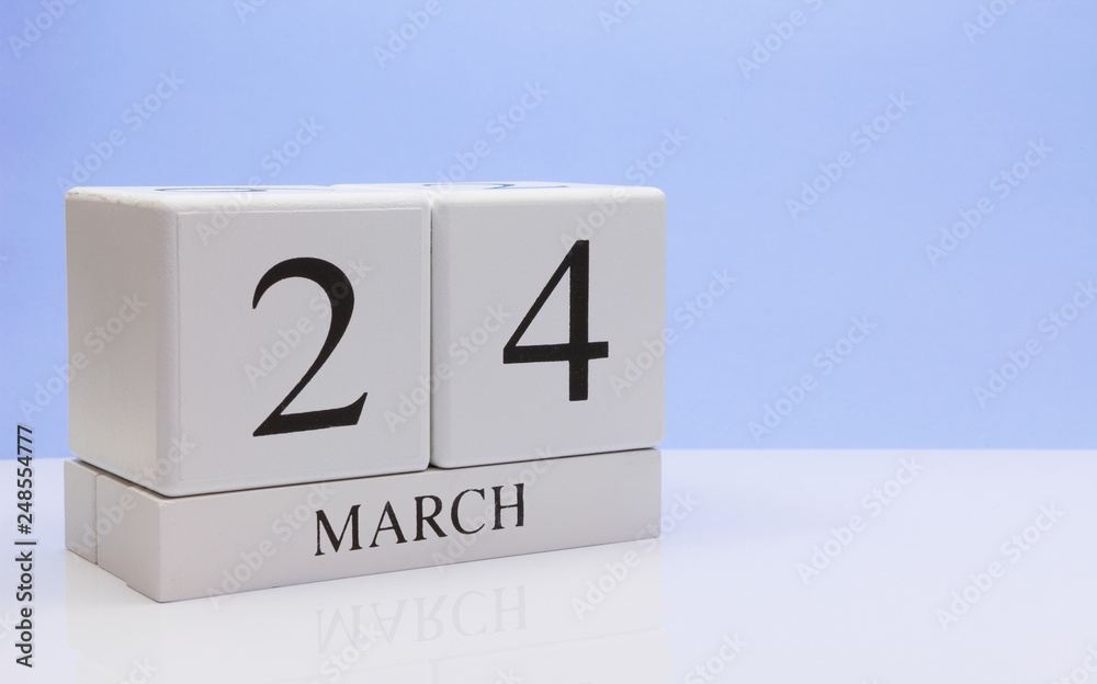 March 24st. Day 24 of month, daily calendar on white table with reflection, with light blue background. Spring time, empty space for text March 24st. Day 24 of month, daily calendar on white table with reflection, with light blue background. Spring time, empty space for text