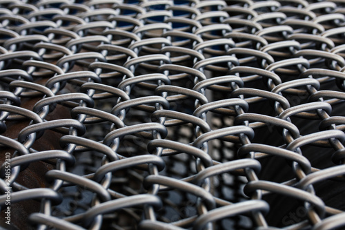 Metal chain fence seamless texture background texture. Abstract background of steel chain fences. Woven silver metal mesh. Industrial Strength or power concept background image. Metal or steel pattern
