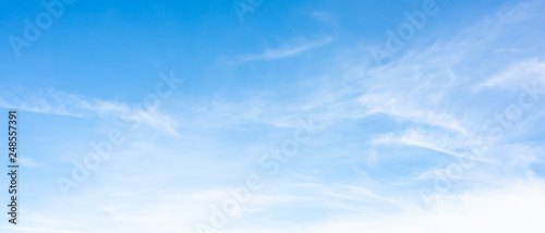 Clouds on a blue sky as background photo