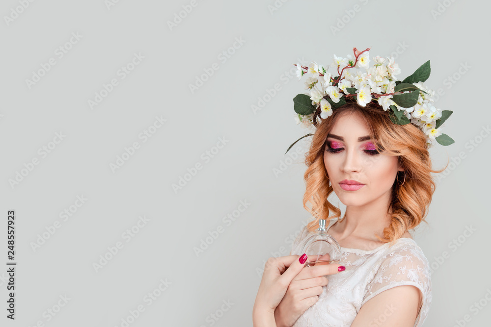 woman with headband flowers headband with bottle of perfume woman with headband flowers headband with bottle of perfume
