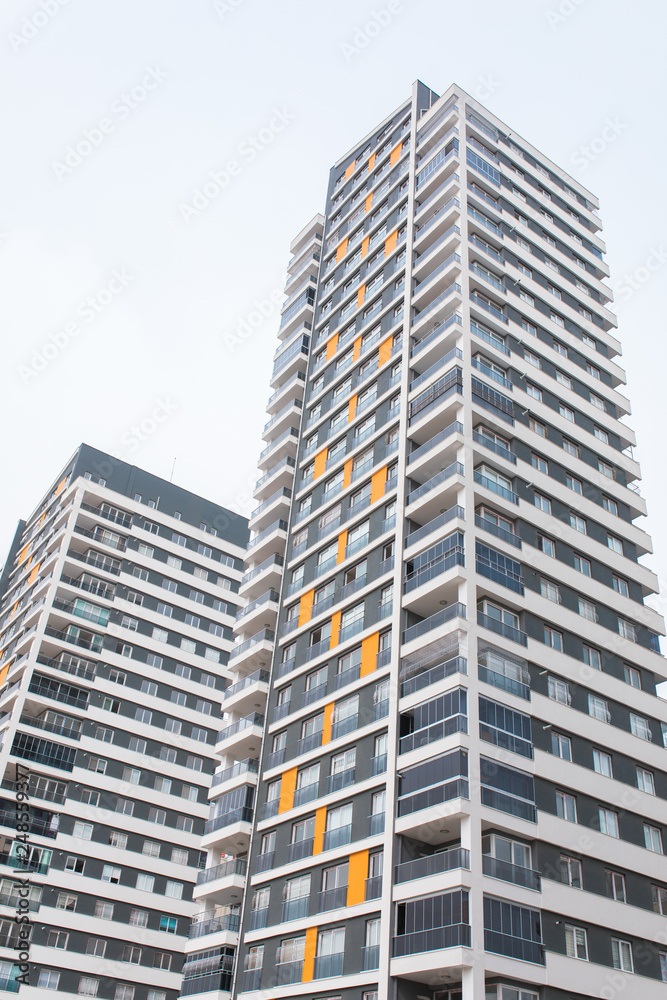 New multi-storey residential building apartment houses. Mortgage and construction background concept image. New multi-storey residential building apartment houses. Mortgage and construction background concept image.
