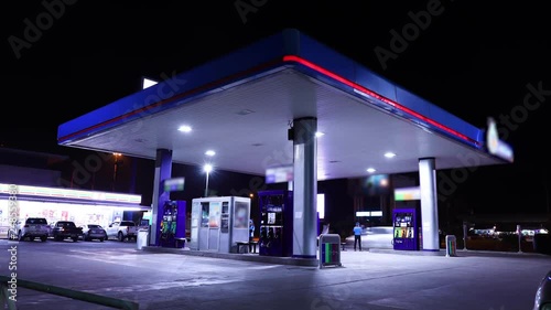 Time lapse of gas station, car refuel the energy photo