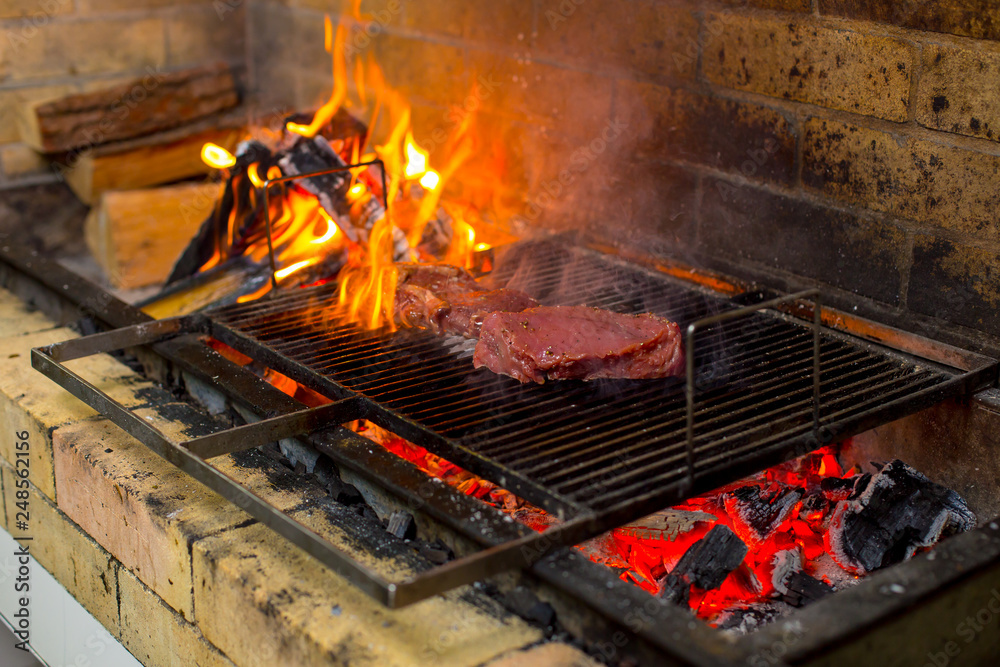 grilled meat and vegetables on an open fire grilled meat and vegetables on an open fire