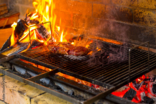 grilled meat and vegetables on an open fire