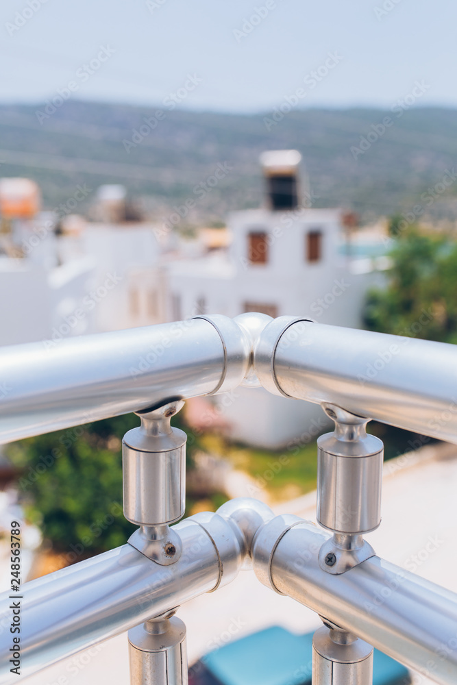 Stainless steel metal railing edge profile section on the balcony Stainless steel metal railing edge profile section on the balcony