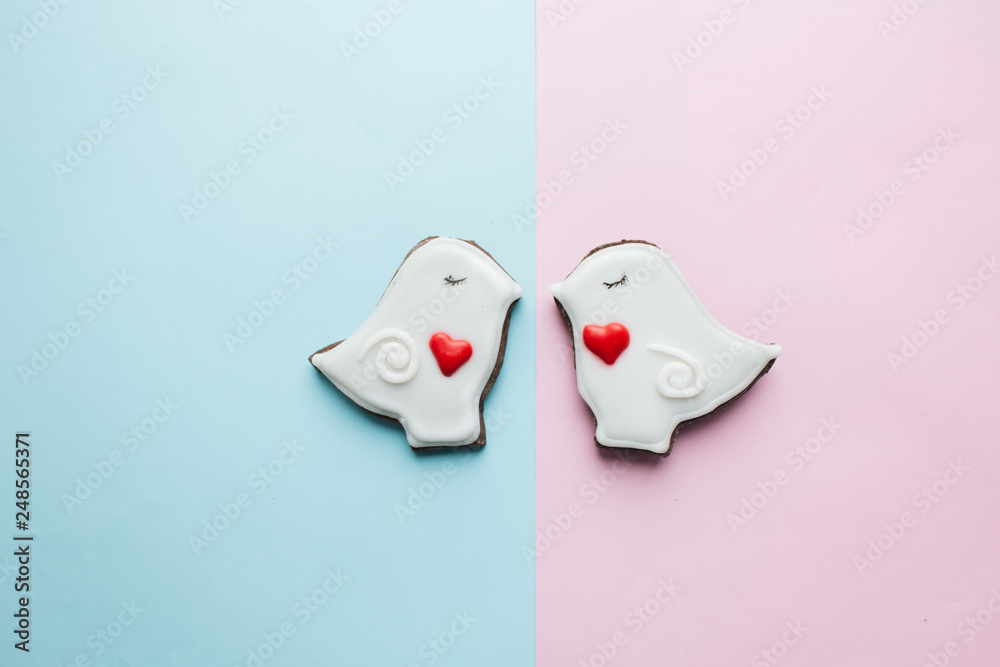 Two cookies in heart shape two doves with glaze Two cookies in heart shape two doves with glaze