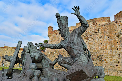 Bronze statue of a soldier and a cannon at Ceuta Castle, Ceuta, Spain photo