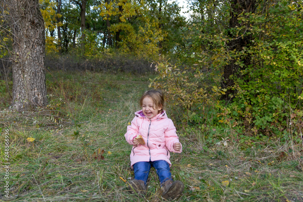 Funny child eating pie in the forest Funny child eating pie in the forest