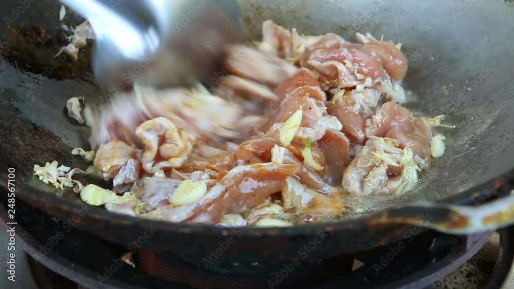 Frying chopped pork with sauce in pan Frying chopped pork with sauce in pan