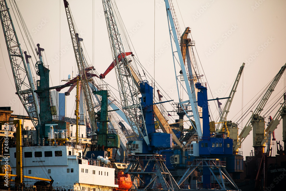 Sea facade in the capital of the Far East, the city of Vladivostok. Sea trading port with ships. Drifting ships in the raid.