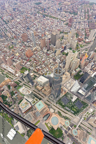 Wide-angle aerial view over World Trade Center and Tribeca, looking north-east towards Little Italy, with helicopter skid in shot