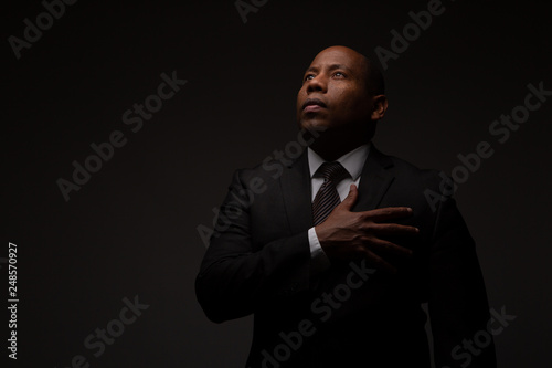 African American Christian Man Making a Covenant with God