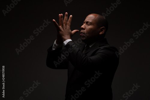 African American Christian Man Praying and Seeking Guidance from God