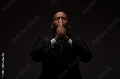African American Christian Man Praying and Seeking Guidance from God