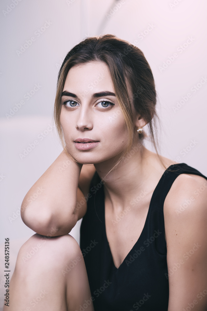 Portrait of young gorgeous woman on sofa, shallow depth of field Portrait of young gorgeous woman on sofa, shallow depth of field