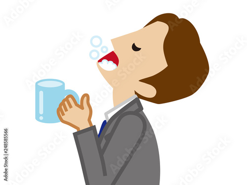 Businessman gargling with water for prevent cold