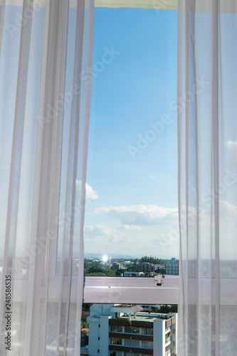 white curtain on glass window