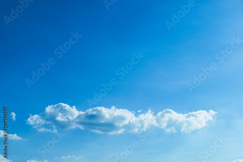 fluffy cloud above clear blue sky