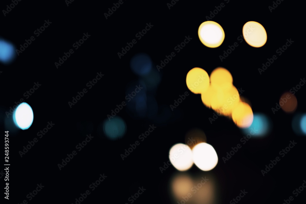 Fototapeta premium Light spots on black background