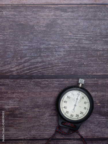 old Stopwatch on wooden table background
