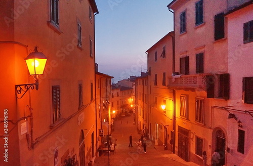 Typical street at sunset of the village of Castagneto Carducci  Tuscany  Italy