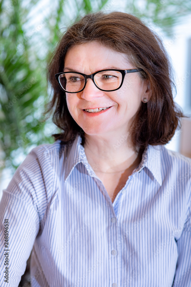 Woman with glasses in middle age Woman with glasses in middle age