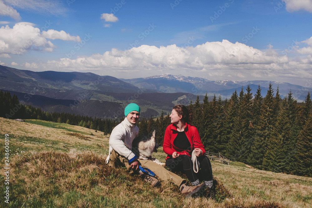 Fototapeta premium Guy and girl on top of the mountain