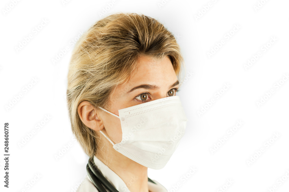 Close-up portrait of a beautiful girl doctor on a blue isolated background. Concept medicine Close-up portrait of a beautiful girl doctor on a blue isolated background. Concept medicine