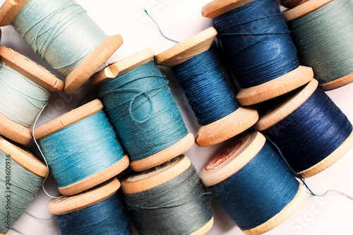 Sewing thread blue on white background