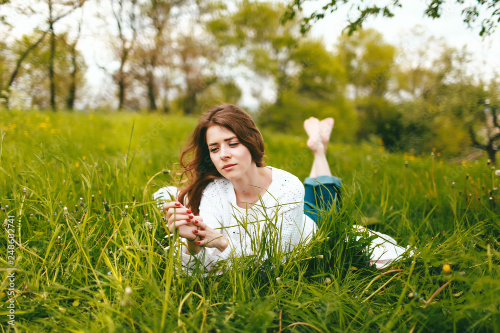 young girl in the flowered garden Girl and flowering trees young girl in the flowered garden Girl and flowering trees