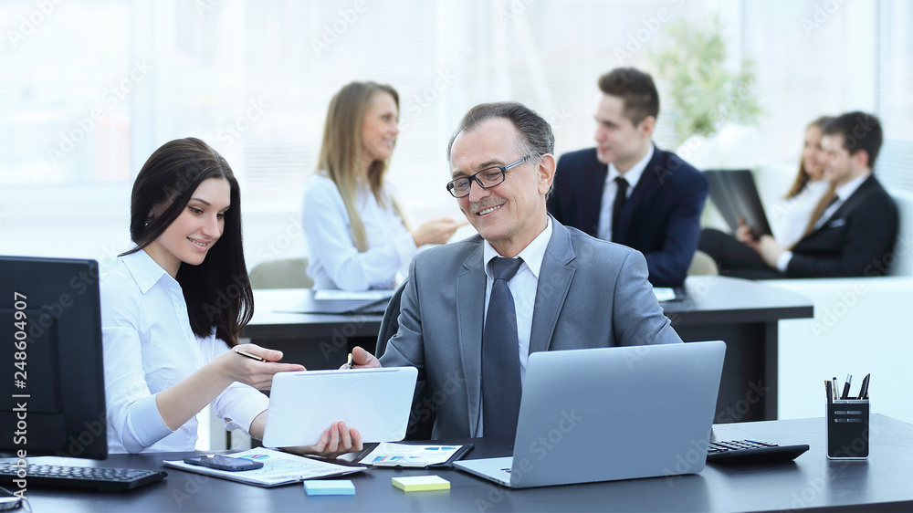 Businessman analyzing investment, budget and income charts at his workplace Businessman analyzing investment, budget and income charts at his workplace