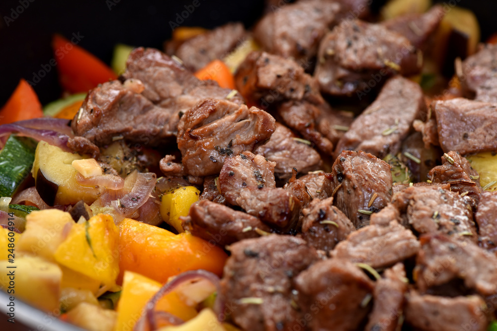 Beef stew with potatoes, carrots and sweet peppers. Beef stew with potatoes, carrots and sweet peppers.