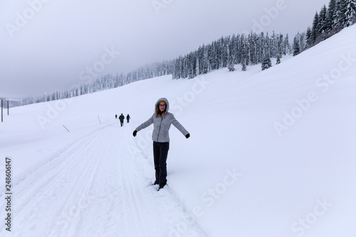 Hapopy tourist lady in her winter holiday in the mountains
